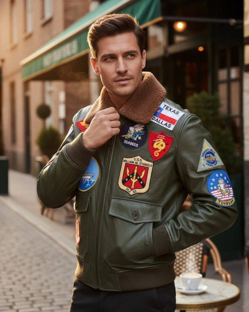 Man wearing a green jacket with various patches on a street.